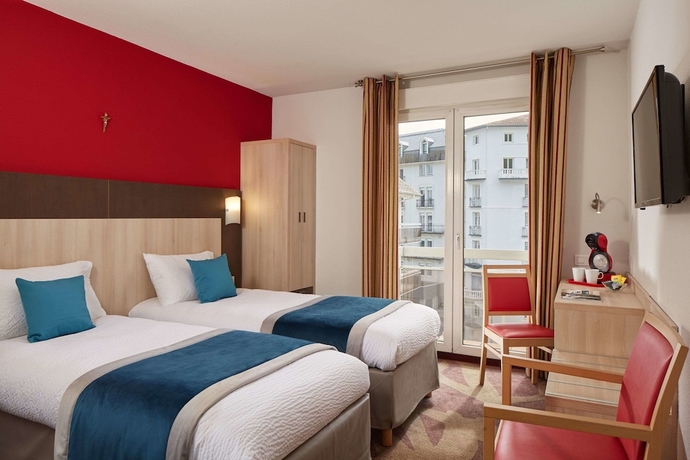 Imagen de la habitación del Hotel Roissy Lourdes. Foto 9