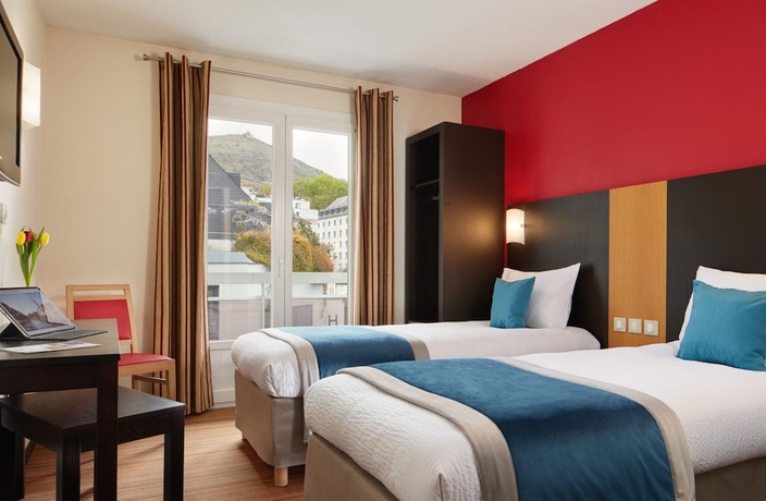 Imagen de la habitación del Hotel Roissy Lourdes. Foto 14