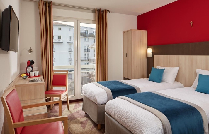 Imagen de la habitación del Hotel Roissy Lourdes. Foto 16