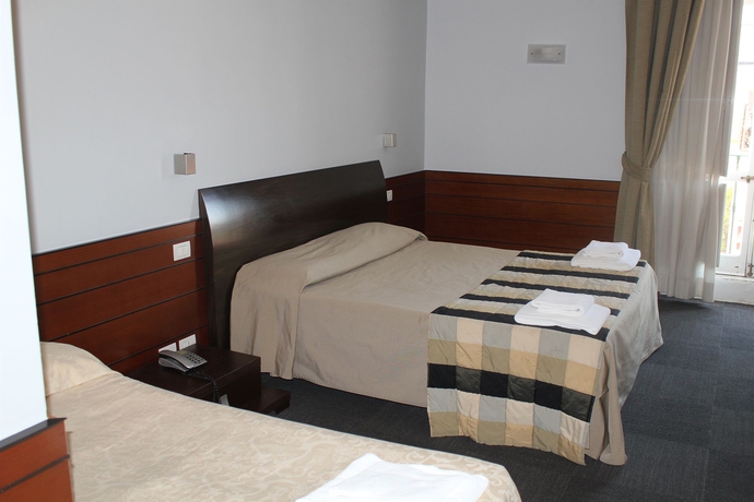 Imagen de la habitación del Hotel Romalive. Foto 11