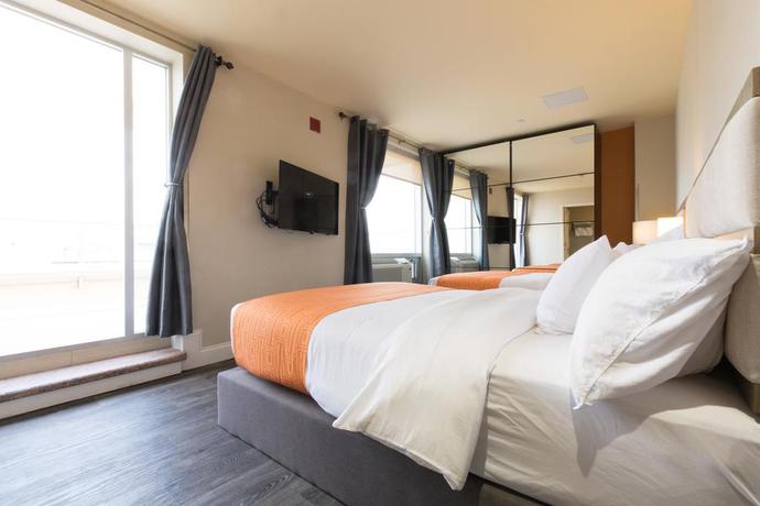 Imagen de la habitación del Hotel Romana Hotel - NYC. Foto 7