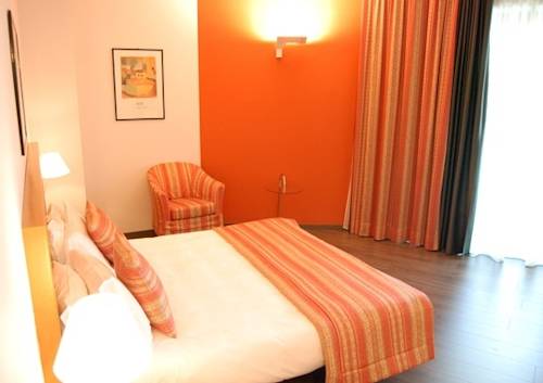 Imagen de la habitación del Hotel Romanisio. Foto 11