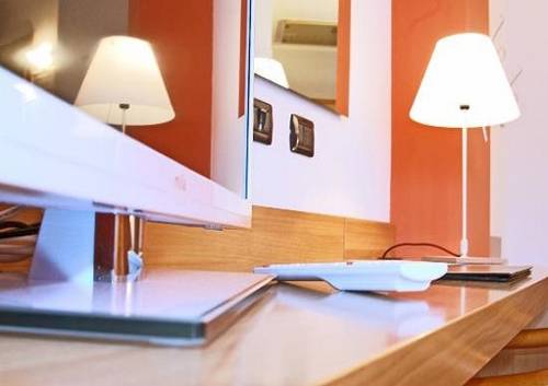 Imagen de la habitación del Hotel Romanisio. Foto 15