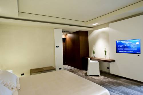 Imagen de la habitación del Hotel Romano House. Foto 7