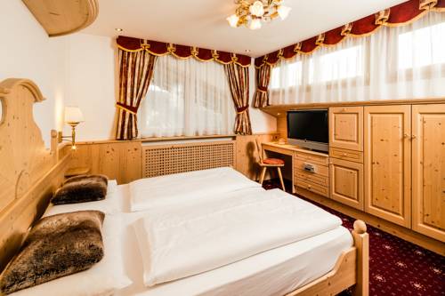 Imagen de la habitación del Hotel Romantic and Family Gardenia. Foto 10