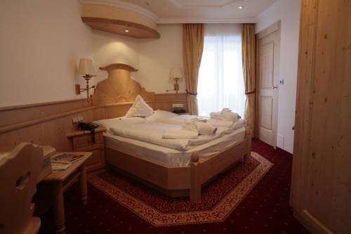 Imagen de la habitación del Hotel Romantic and Family Gardenia. Foto 13