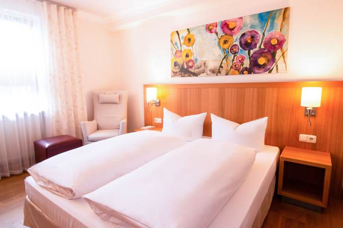 Imagen de la habitación del Hotel Romantik Hirschen. Foto 2