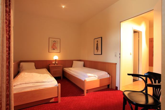 Imagen de la habitación del Hotel Romantik Residenz Ferienwohnungen Hotel Im Weissen R&ouml;ssl. Foto 15