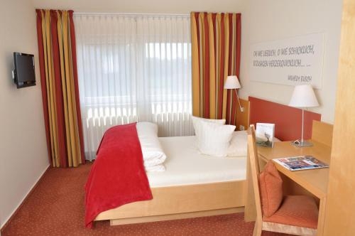Imagen de la habitación del Hotel Romantik Schmiedegasthaus Gehrke. Foto 7