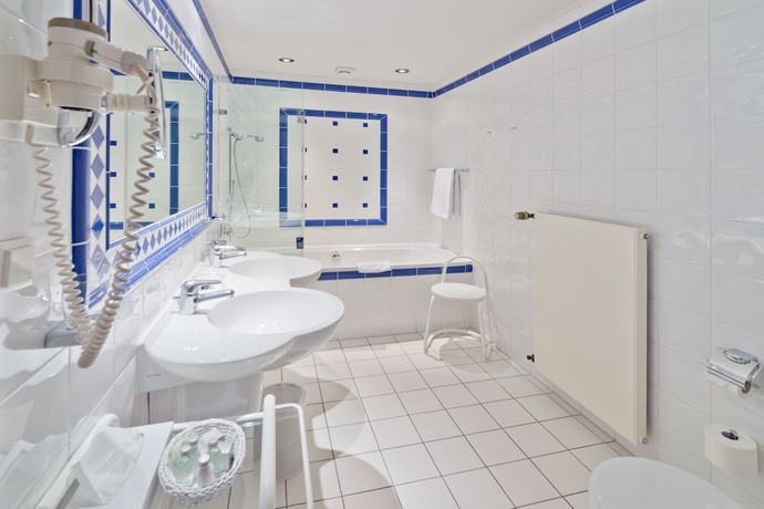 Imagen de la habitación del Hotel Romantik Waldhotel Mangold. Foto 8