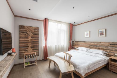 Imagen de la habitación del Hotel Ron Inn Xingping Hepan Xiaozhu. Foto 8