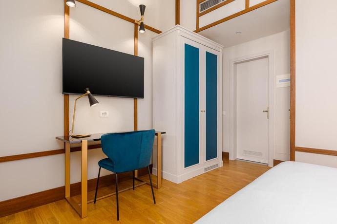 Imagen de la habitación del Hotel Room Mate Luca. Foto 7