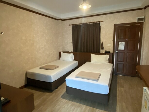 Imagen de la habitación del Hotel RoomQuest Chonburi Laem Chabang. Foto 19