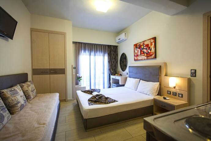 Imagen de la habitación del Hotel Rooms Amalthea Mare and Cafe - Bistro. Foto 13