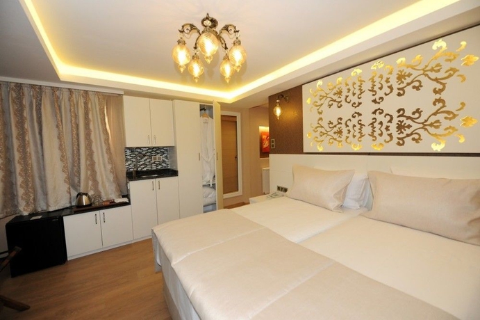 Imagen de la habitación del Hotel Rooms Inn Taxim. Foto 13