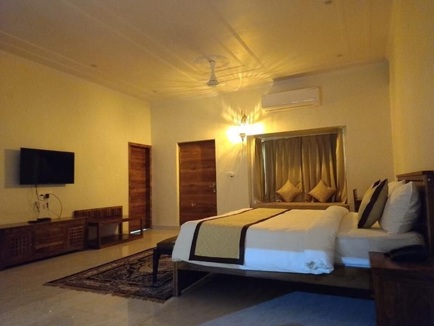Imagen de la habitación del Hotel Roop Garh Palace. Foto 6