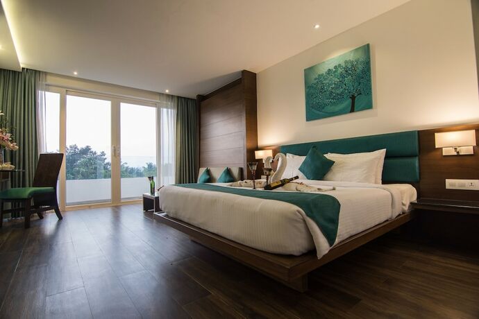 Imagen de la habitación del Hotel Roopa Elite. Foto 21