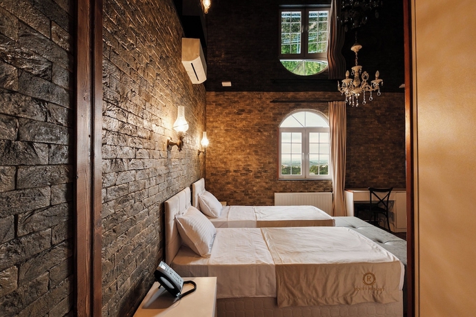 Imagen de la habitación del Hotel Roots Resort. Foto 7