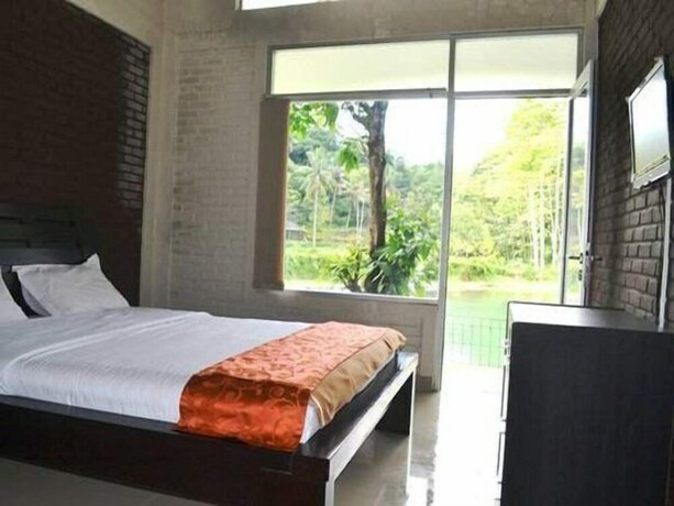 Imagen de la habitación del Hotel Rorompok Homan. Foto 5