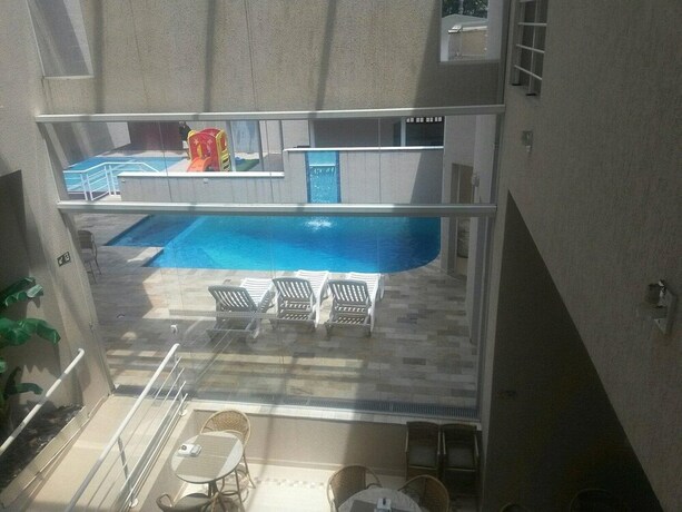 Imagen de la habitación del Hotel Rosa Da Ilha Guaruja - Perto Do Mar. Foto 19
