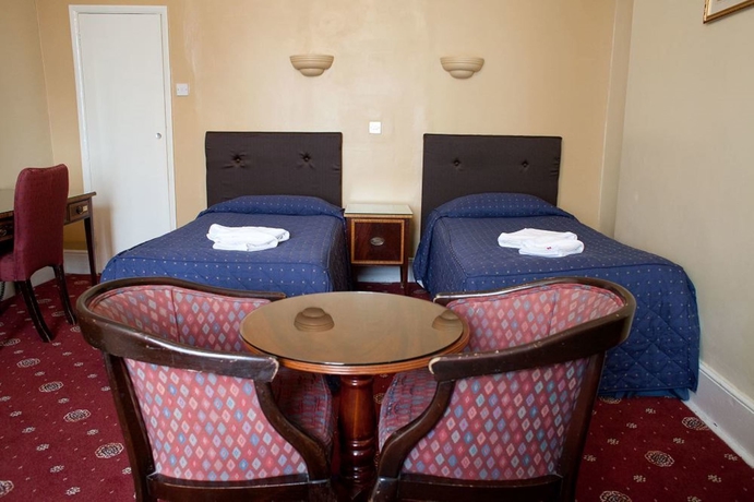 Imagen de la habitación del Hotel Rose Court. Foto 7