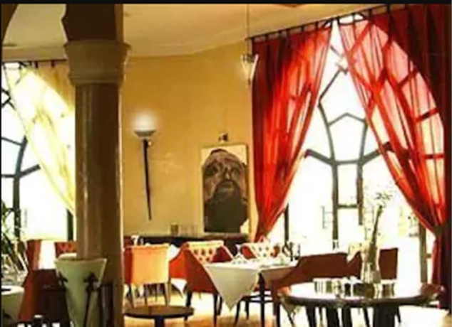 Imagen del bar/restaurante del Hotel Rose Garden Resort and Spa. Foto 3