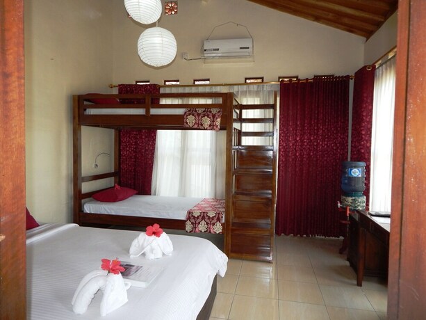 Imagen de la habitación del Hotel Rosella Cottage Yogyakarta. Foto 19