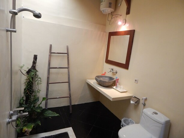 Imagen de la habitación del Hotel Rosella Cottage Yogyakarta. Foto 20