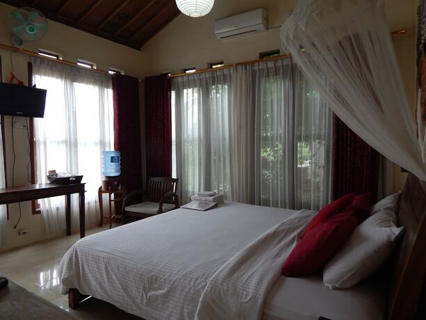 Imagen de la habitación del Hotel Rosella Cottage Yogyakarta. Foto 23