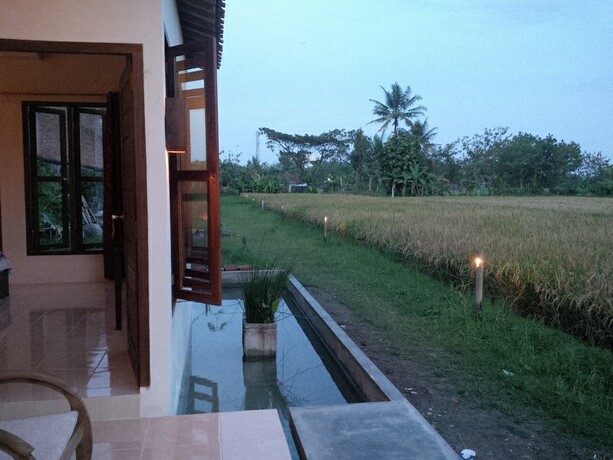 Imagen de la habitación del Hotel Rosella Cottage Yogyakarta. Foto 24