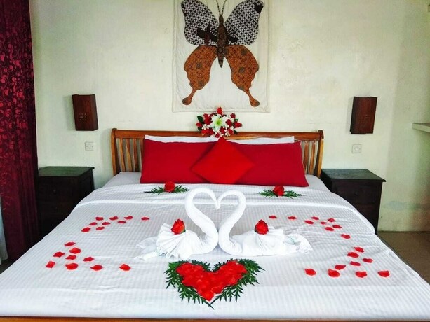 Imagen de la habitación del Hotel Rosella Cottage Yogyakarta. Foto 25