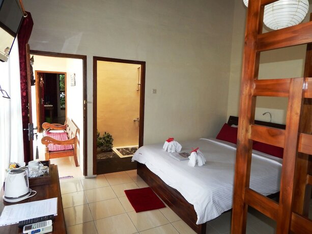 Imagen de la habitación del Hotel Rosella Cottage Yogyakarta. Foto 27