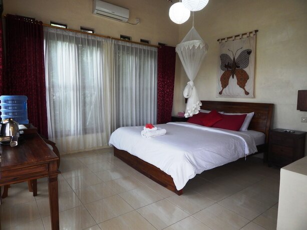 Imagen de la habitación del Hotel Rosella Cottage Yogyakarta. Foto 28