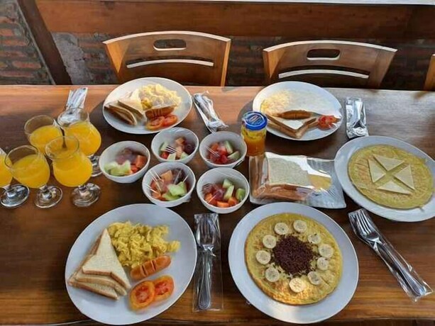 Imagen de la habitación del Hotel Rosella Cottage Yogyakarta. Foto 30