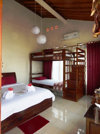 Imagen de la habitación del Hotel Rosella Cottage Yogyakarta. Foto 31
