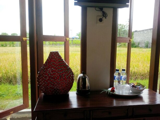 Imagen de la habitación del Hotel Rosella Cottage Yogyakarta. Foto 32