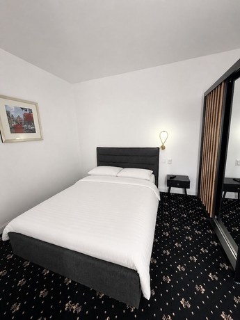 Imagen de la habitación del Hotel Rosetti Inn. Foto 12