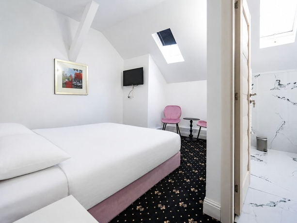 Imagen de la habitación del Hotel Rosetti Inn. Foto 15
