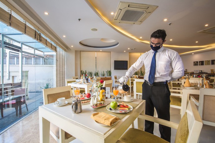 Imagen del bar/restaurante del Hotel Rosewood Apartment - Gurgaon. Foto 4