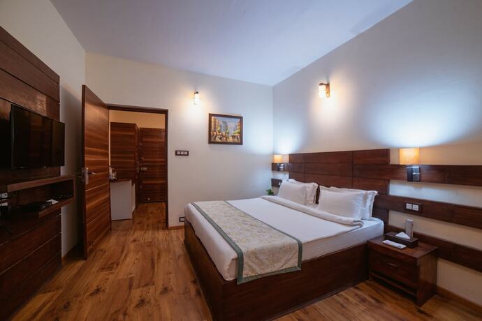 Imagen de la habitación del Hotel Rosewood Dhanachuli Retreat. Foto 17