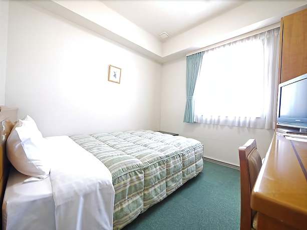 Imagen de la habitación del Hotel Route-inn Fukuioowada. Foto 14