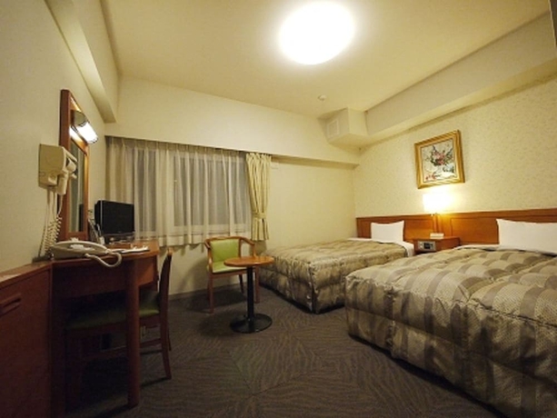 Imagen de la habitación del Hotel Route-inn Yokohama Bashamichi. Foto 2