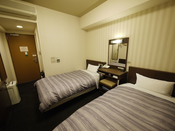 Imagen de la habitación del Hotel Route-inn Yokohama Bashamichi. Foto 12