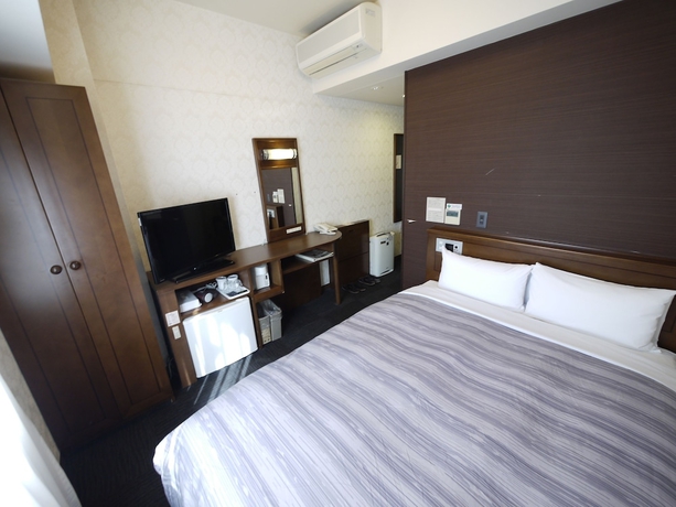 Imagen de la habitación del Hotel Route-inn Yokohama Bashamichi. Foto 13