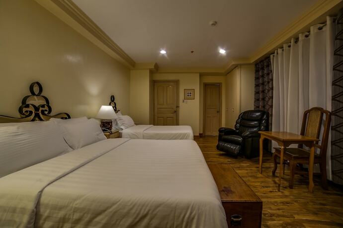 Imagen de la habitación del Hotel Roxas President's Inn. Foto 23