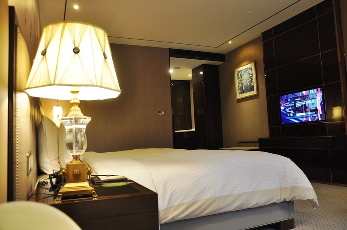 Imagen de la habitación del Hotel Royal Garden Shanghai. Foto 18
