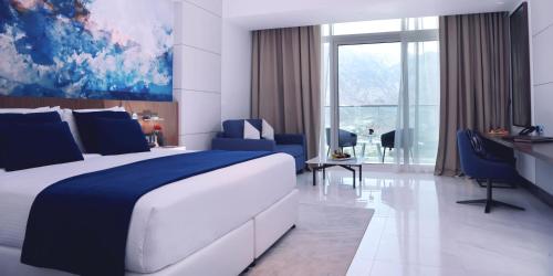 Imagen de la habitación del Hotel Royal M Al Aqah Beach Resort by Gewan. Foto 15
