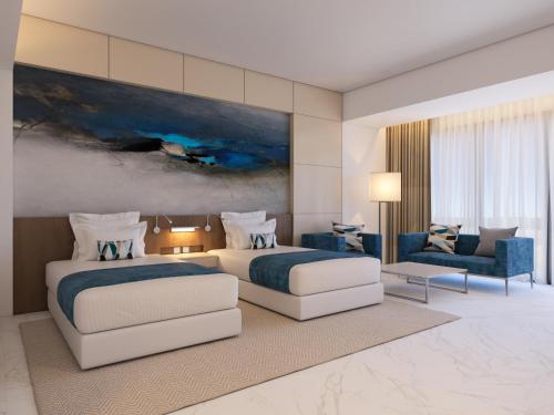 Imagen de la habitación del Hotel Royal M Al Aqah Beach Resort by Gewan. Foto 16