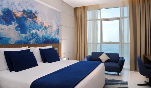 Imagen de la habitación del Hotel Royal M Al Aqah Beach Resort by Gewan. Foto 19