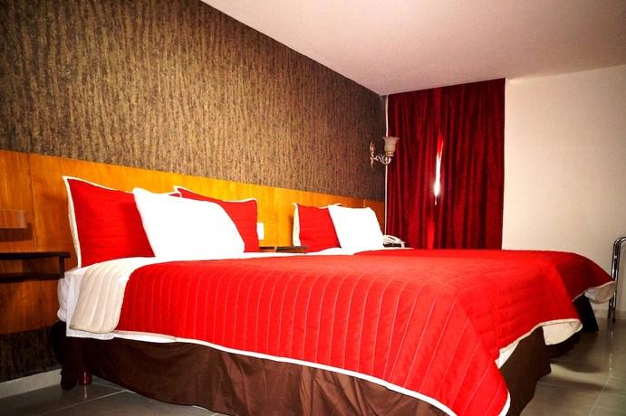 Imagen de la habitación del Hotel Royal Madero Inn. Foto 2